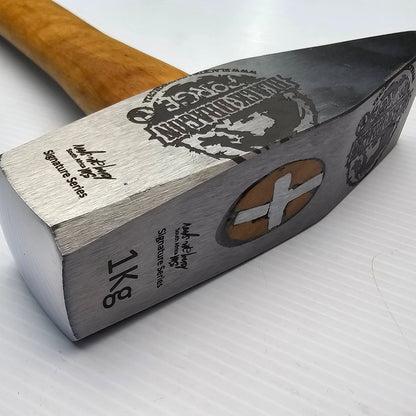 A black and silver cross peen forging hammer with a wooden handle, featuring engravings and the brand Black Dragon.