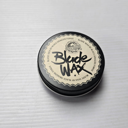 Round container of Blade Wax on a light gray background
