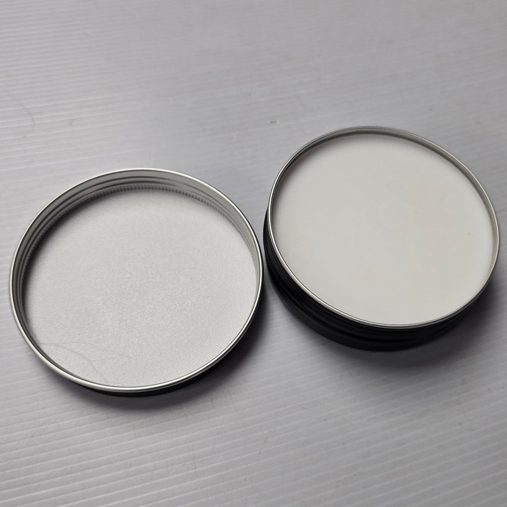 Two metallic rings on a gray textured surface