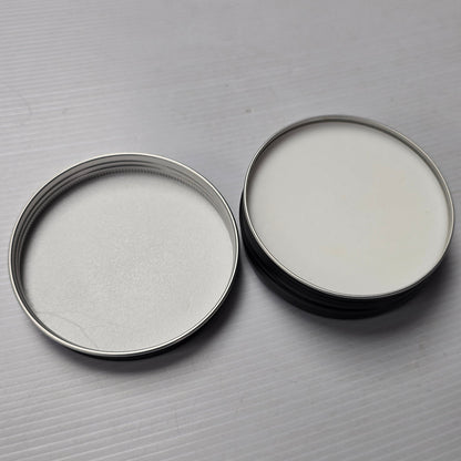 Two metallic rings on a gray textured surface