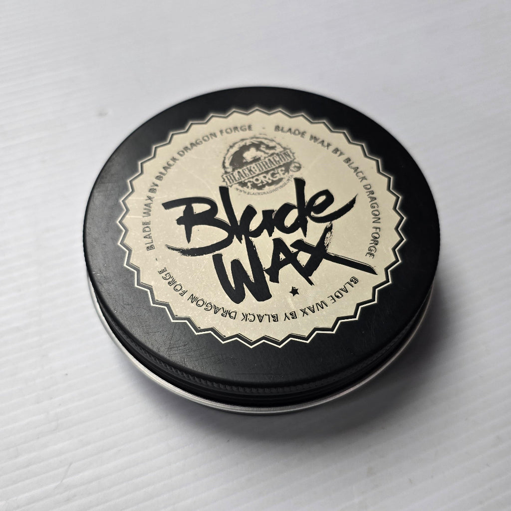 Tin of Blonde Wax on a gray background