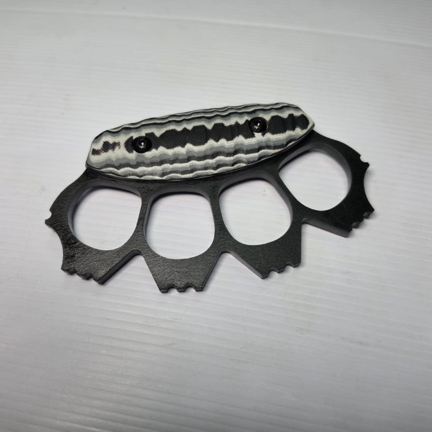 Black metal knuckle duster on a white background