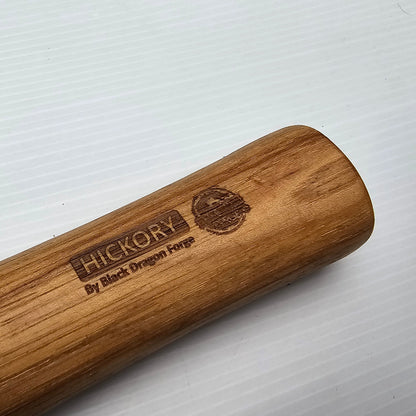 A hickory replacement hammer shaft with a waxed finish, branded with the name 'Hickory' and the phrase 'Best by Forge'.